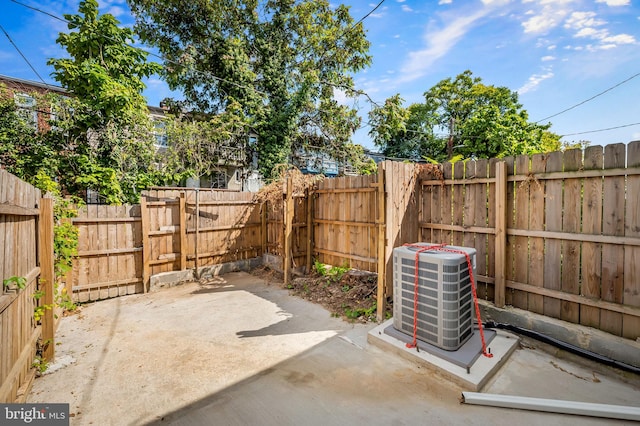 view of patio featuring a fenced backyard and central air condition unit