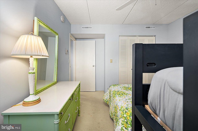 10000 Coastal Hwy Unit 1208, Ocean City, MD 21842 - bedroom featuring a closet, visible vents, light colored carpet, and a textured ceiling