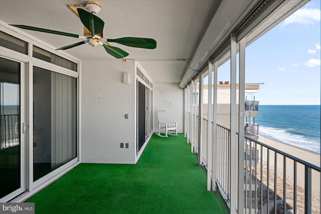 10000 Coastal Hwy Unit 1208, Ocean City, MD 21842 - unfurnished sunroom featuring a view of the beach, a ceiling fan, and a water view