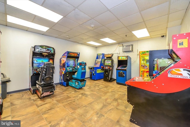 10000 Coastal Hwy Unit 1208, Ocean City, MD 21842 - recreation room with an AC wall unit and a drop ceiling
