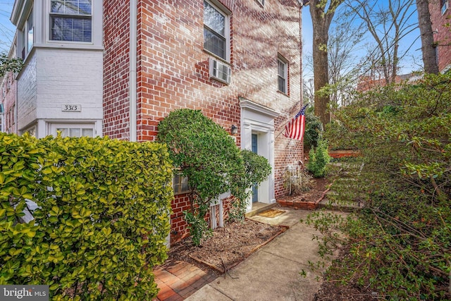 view of side of property with brick siding