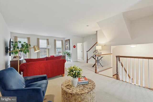 living room with carpet floors and stairway