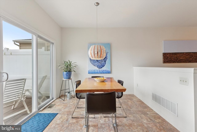 dining room featuring visible vents and baseboards