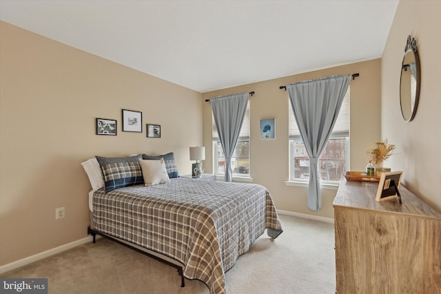 carpeted bedroom with baseboards