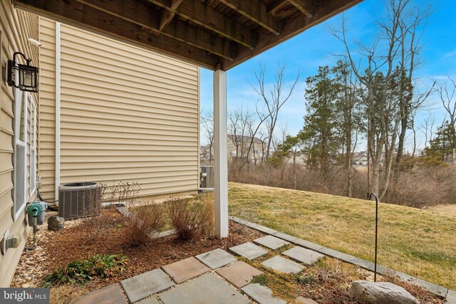 view of yard featuring central air condition unit