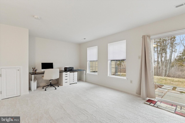 carpeted home office featuring visible vents