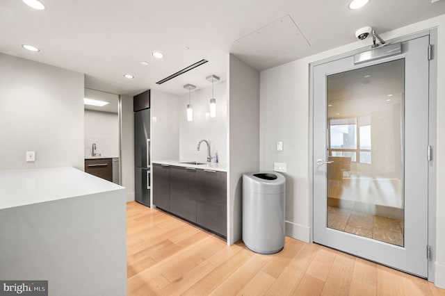 bathroom with recessed lighting, wood finished floors, and vanity