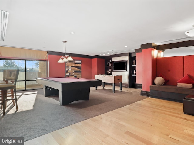 rec room featuring track lighting, wood finished floors, and pool table