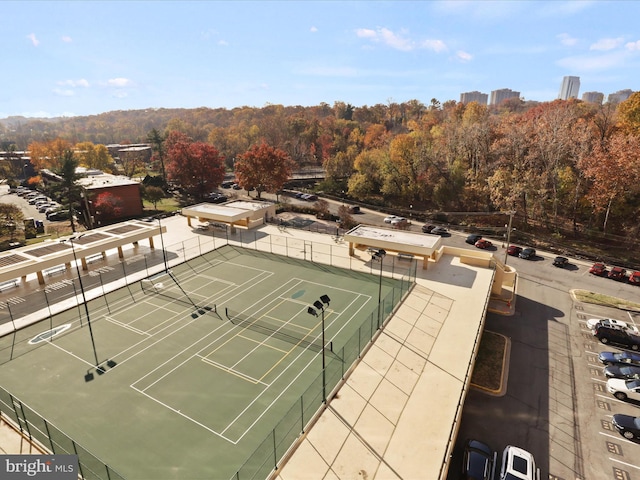 view of tennis court with fence