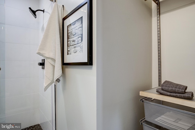 bathroom with a tile shower