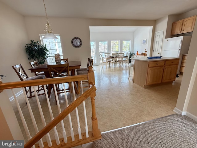 dining area featuring baseboards