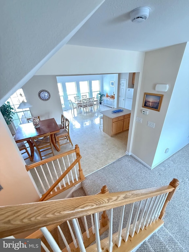 interior space featuring carpet floors and baseboards