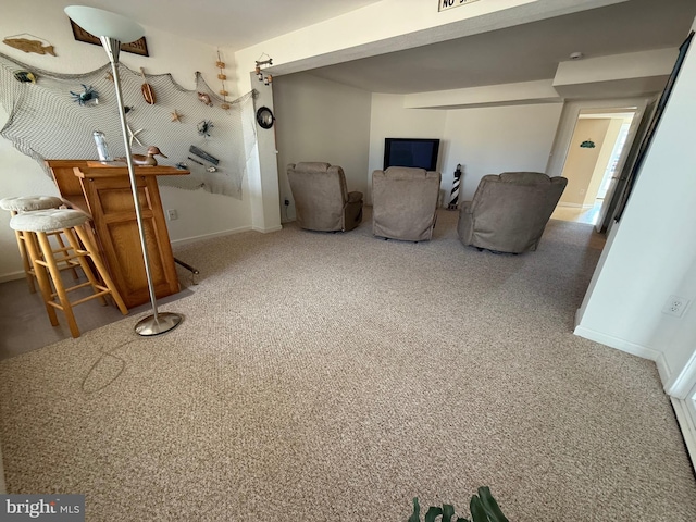 sitting room with carpet and baseboards