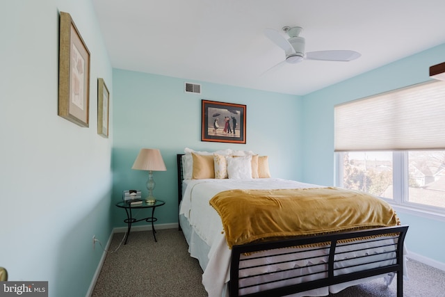 carpeted bedroom featuring baseboards, visible vents, and ceiling fan