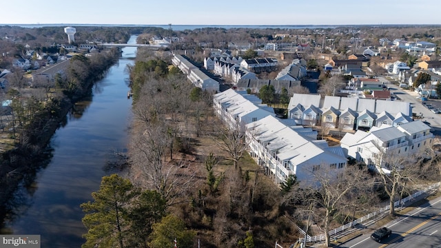 drone / aerial view with a residential view and a water view