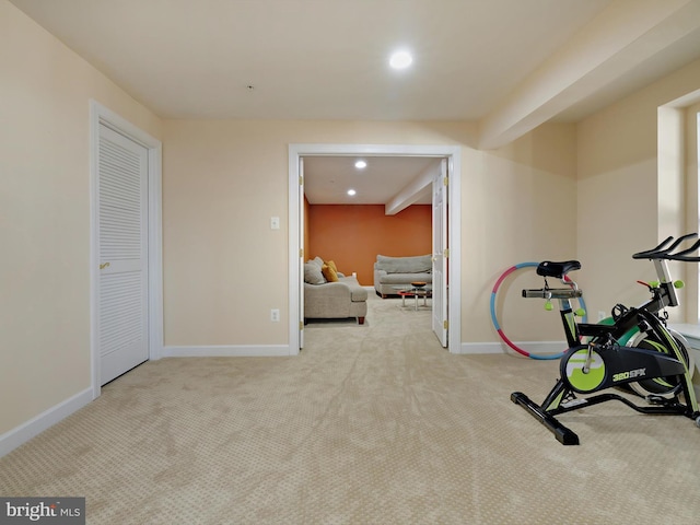 exercise area featuring carpet floors, baseboards, and recessed lighting