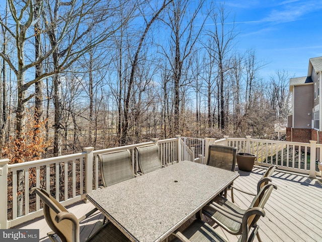 wooden terrace featuring outdoor dining space