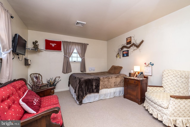 carpeted bedroom with visible vents