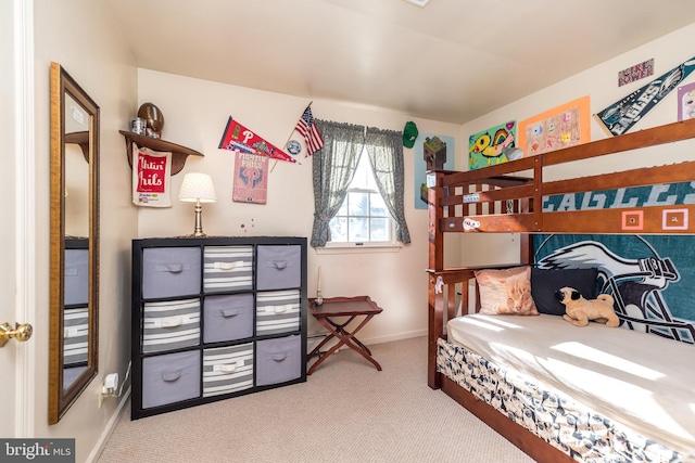 carpeted bedroom with baseboards