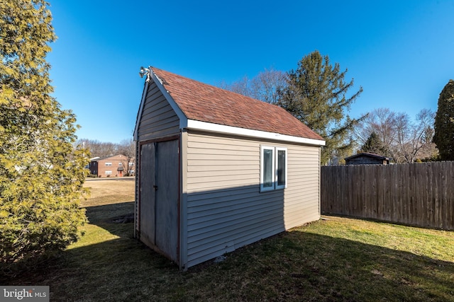 view of shed with fence