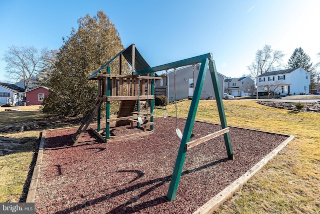 view of play area featuring a residential view and a lawn