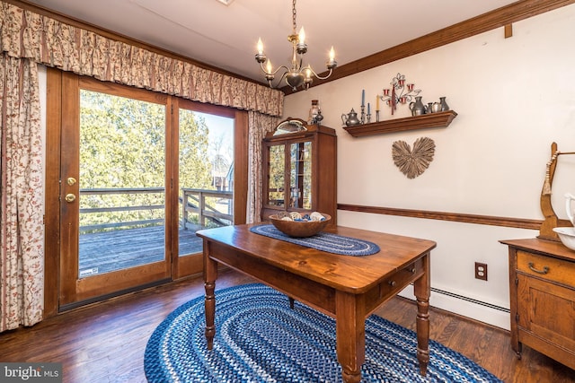 dining room featuring ornamental molding, wood finished floors, an inviting chandelier, and a baseboard radiator