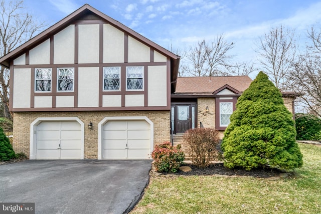 view of front of property with a shingled roof, brick siding, driveway, and stucco siding