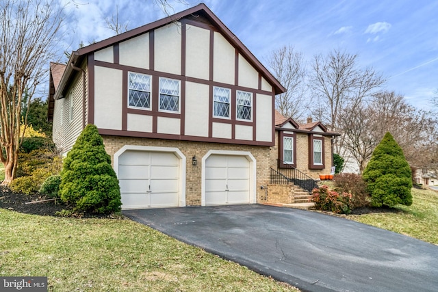 view of property exterior with brick siding, aphalt driveway, and stucco siding