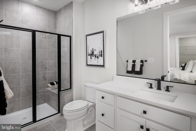 full bathroom with tile patterned flooring, a shower stall, toilet, and vanity