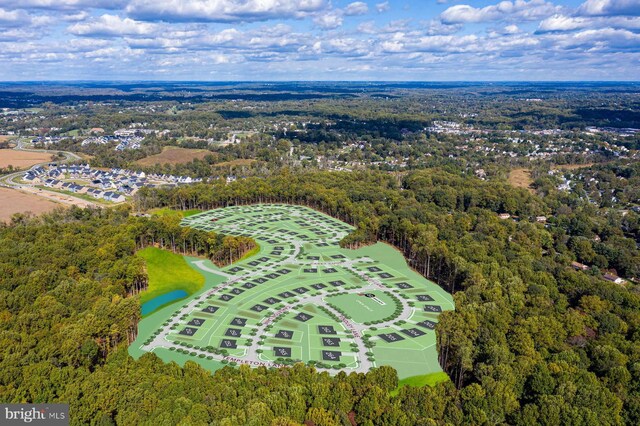 aerial view with a wooded view