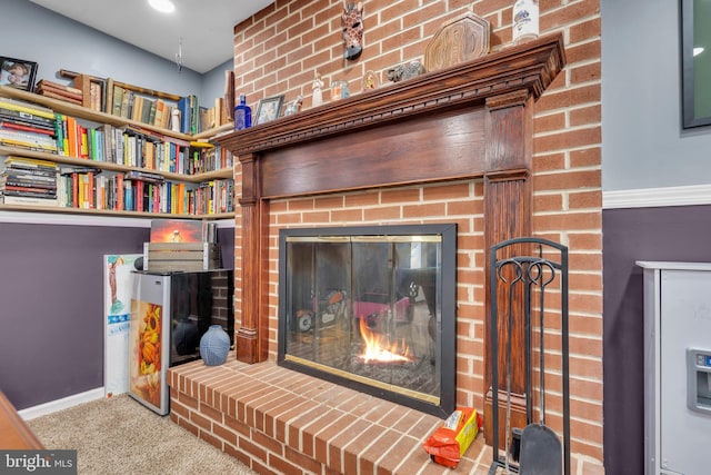 room details with carpet, a fireplace, and baseboards