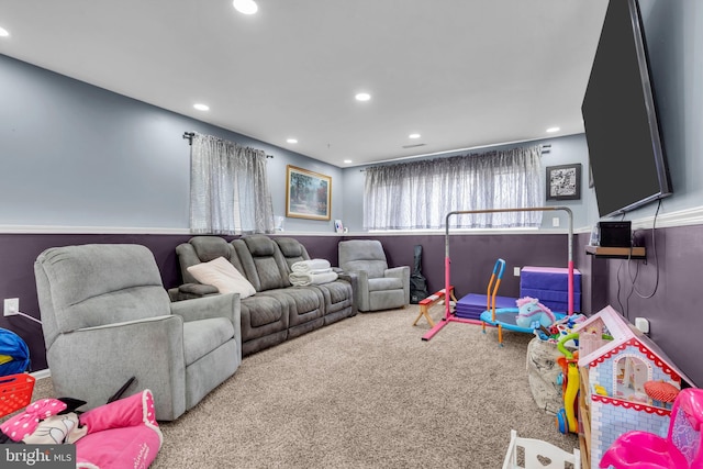 carpeted living area featuring recessed lighting