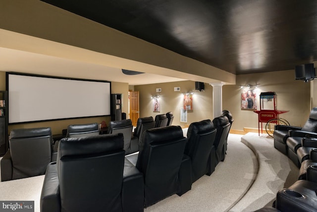 cinema room with visible vents and ornate columns