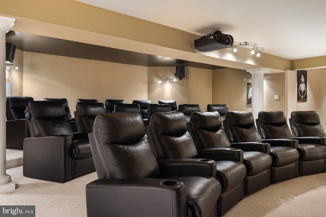 cinema room featuring light colored carpet and decorative columns