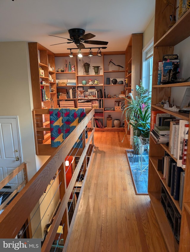 hall with wood-type flooring