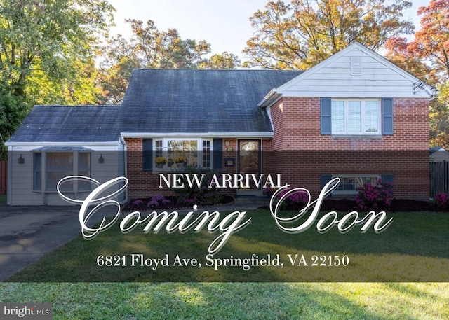 exterior space with brick siding and a front yard