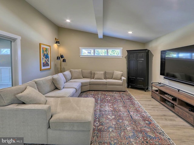 living area with lofted ceiling with beams, light wood-style flooring, and recessed lighting