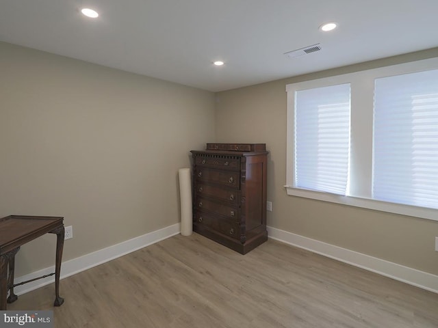 interior space featuring light wood-style floors, visible vents, baseboards, and recessed lighting