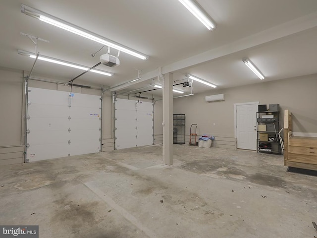 garage with a garage door opener and a wall unit AC