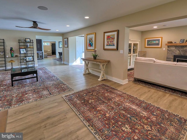 hall with recessed lighting, baseboards, and wood finished floors