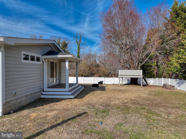 view of yard with a fenced backyard