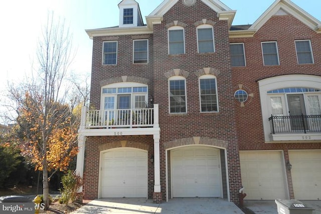 view of front of home featuring brick siding and an attached garage