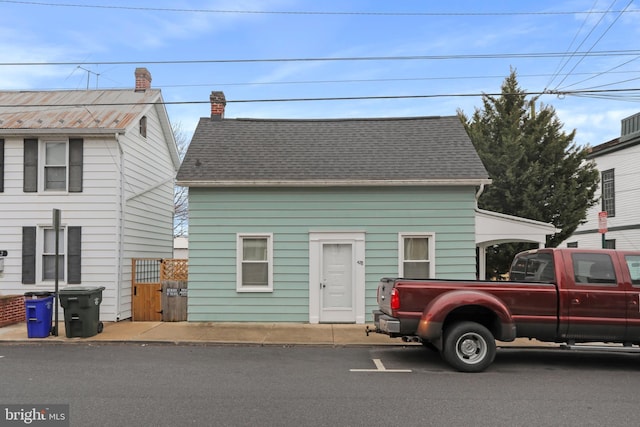 view of front of house featuring roof with shingles