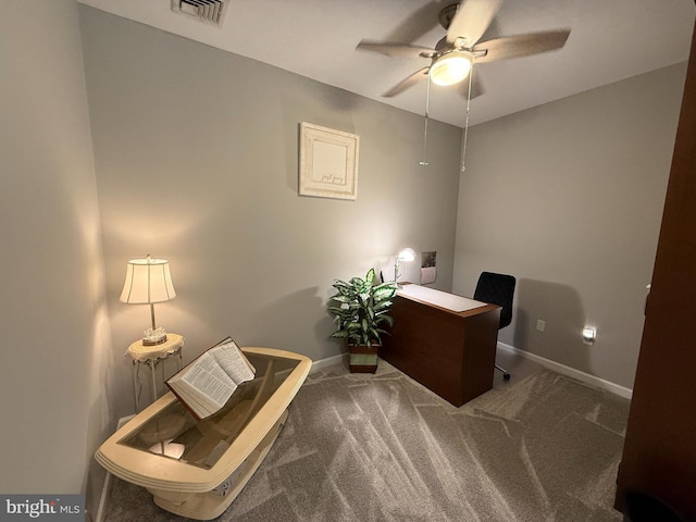 carpeted home office with ceiling fan, visible vents, and baseboards