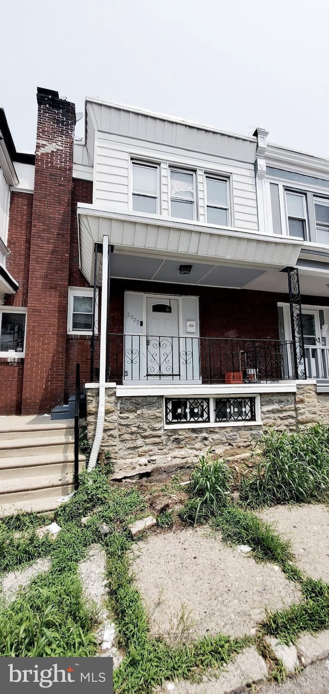 multi unit property featuring covered porch