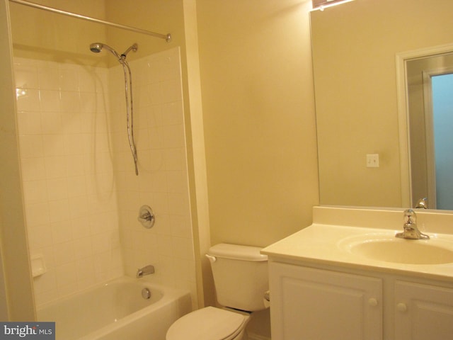 bathroom with shower / washtub combination, vanity, and toilet