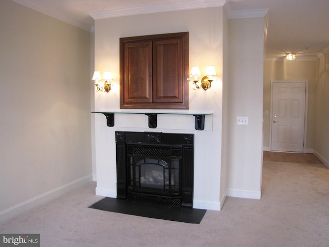 interior details featuring baseboards, ornamental molding, and carpet flooring