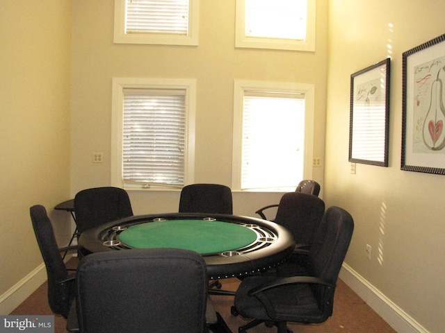 recreation room with baseboards