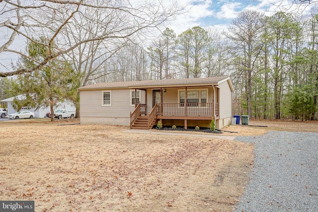 manufactured / mobile home featuring a porch