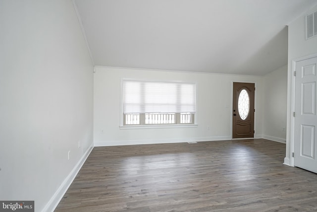 entryway with lofted ceiling, baseboards, wood finished floors, and ornamental molding